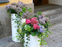 Street Florals in Helsinki, copyright 2012, Stephanie Maatta containers of flowers on a door stoop in Helsinki Finland
