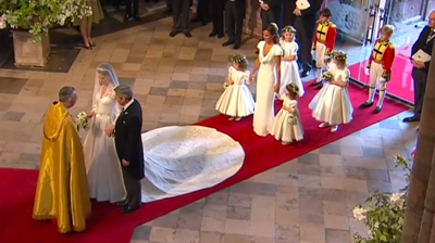 The Middletons inside the Abbey, meet the priest. YouTube 2011.