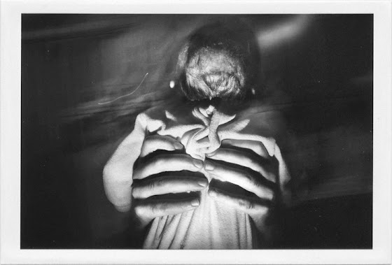 dirty photos - a - dark double exposure photo of man hands lifting a baby