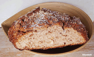 finished bread in basket with cut surface visible