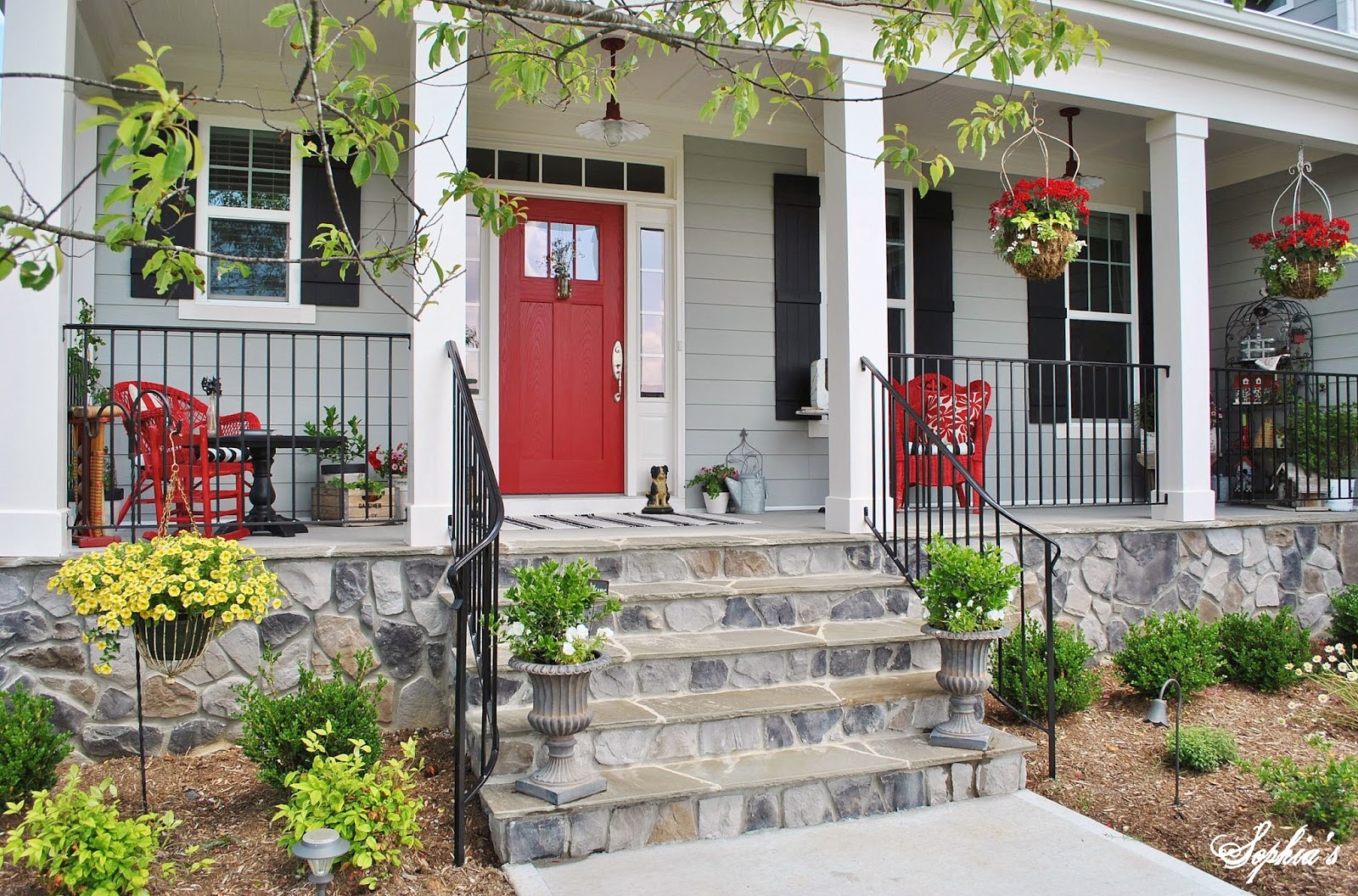 Sophia S Farmhouse Style Front Porch With Pops Of Red