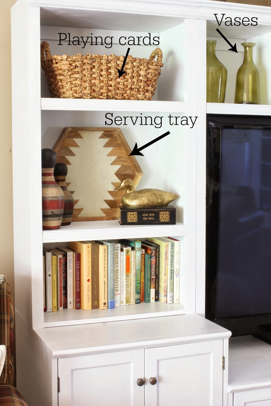 Family room storage solutions in a wall unit and baskets-www.goldenboysandme.com