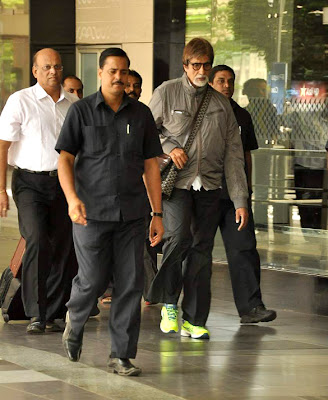 Amitabh Bachchan snapped in green florescent sports shoes 