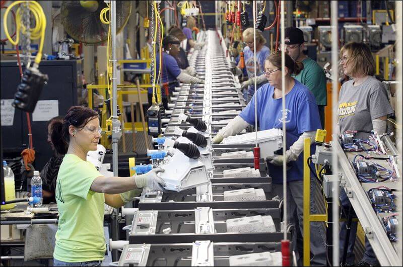 workers on the line at whirlpool corps Kitchenaid factory