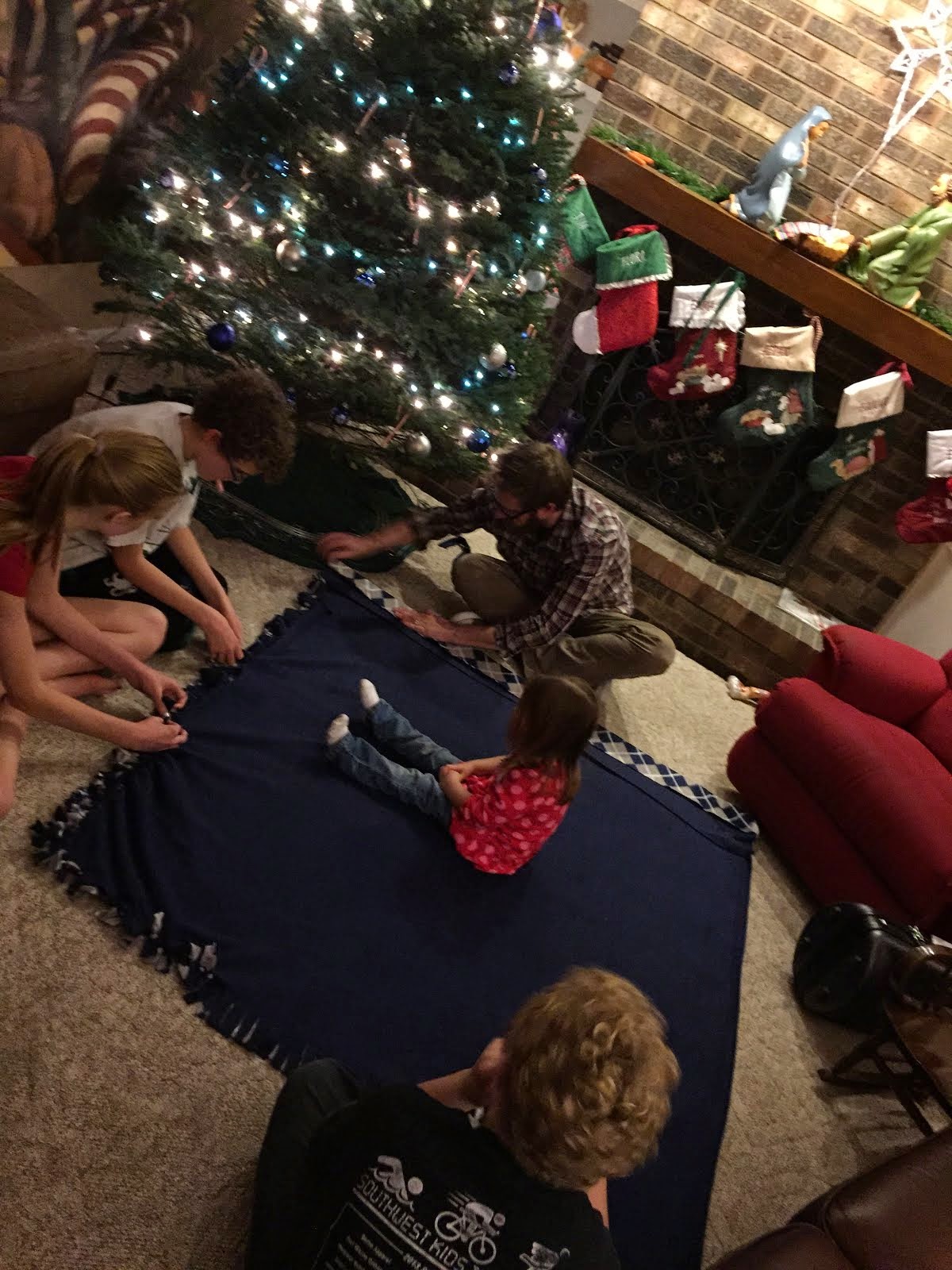 Kids making a blanket for Poppa