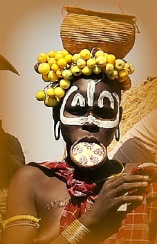 Mursi girl with painted lip plate