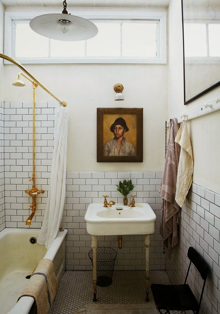 White bathrooms with brass fixture