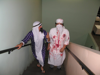 GotPrint halloween 2011 costumes arab and butcher walking up the stairs