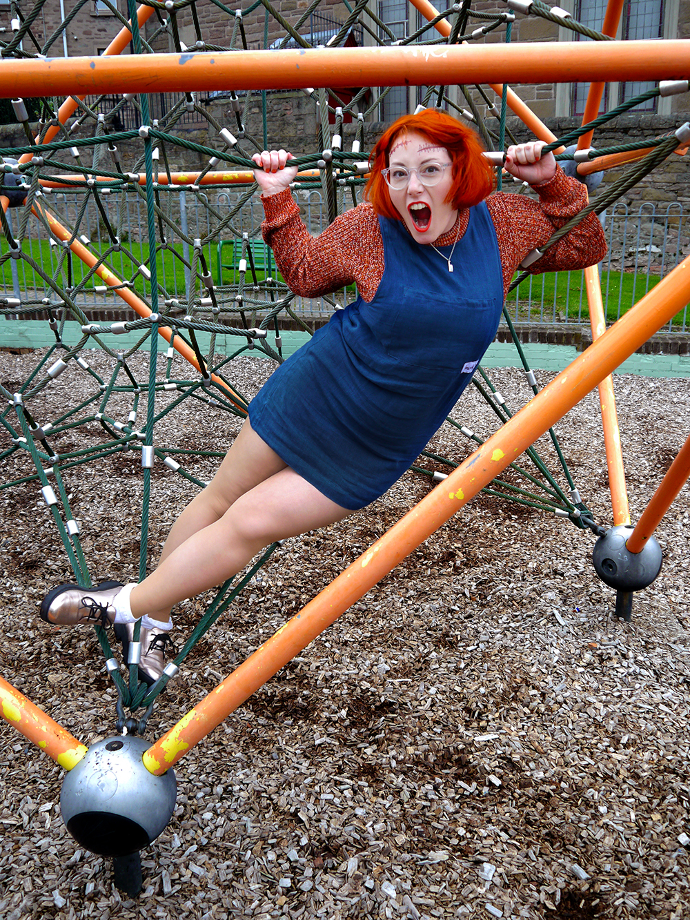 Unlikely Style Icon: Child's Play Unlikely Style Icon, Child's Play, Chucky, Halloween costume, easy halloween costume, wearable halloween costume, halloween inspiration, Ginger halloween costume idea, red head, ginger, Scottish blogger, IOLLA glasses, Kerrie Aldo, KerrieALDO pinafore, blue pinafore dress, oragne jumper, unlikey horror icon
