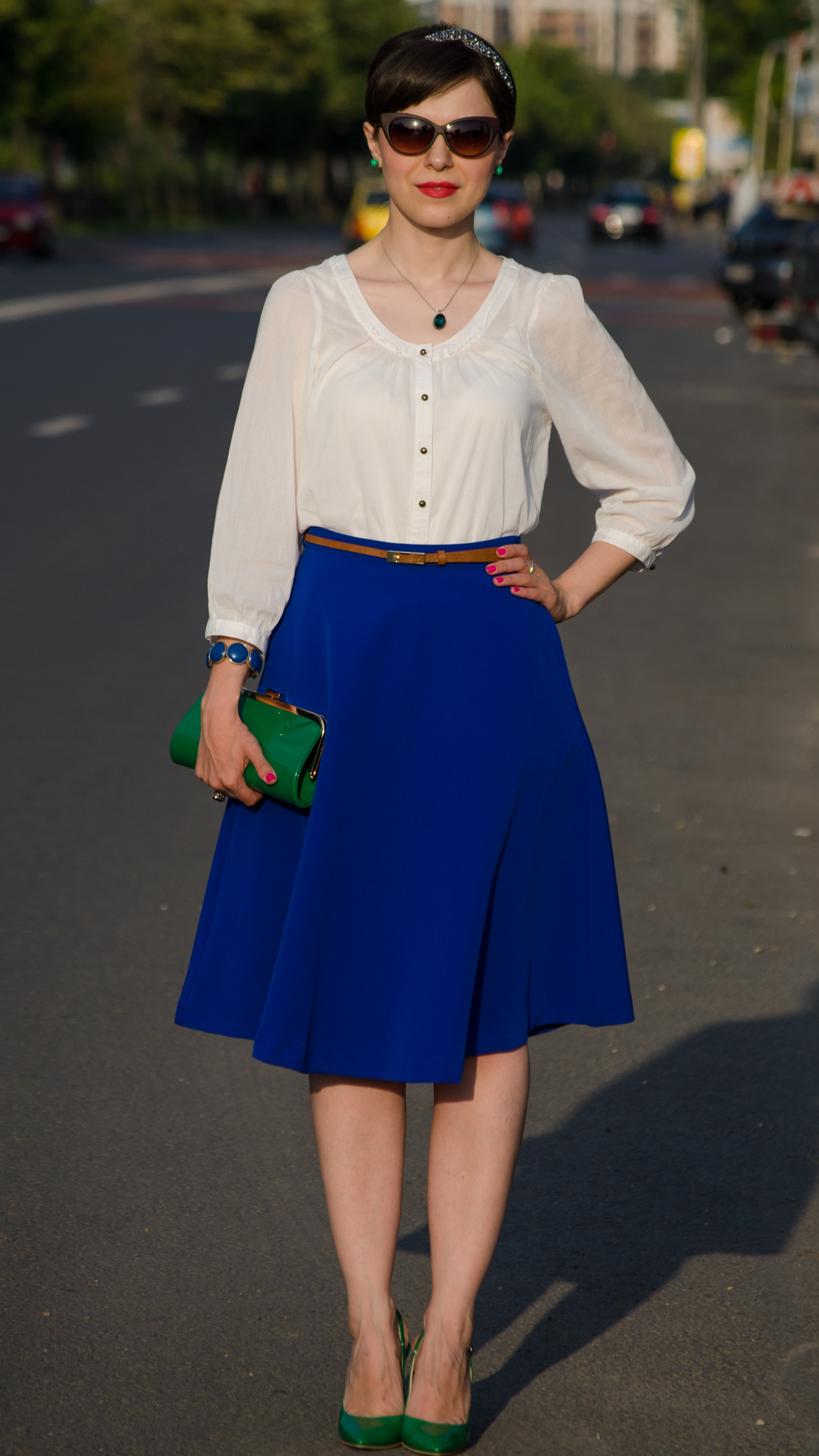 cobalt skirt white shirt emerald green heels emerald green clutch