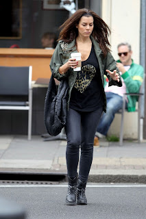 Imogen Thomas with a cup of coffee