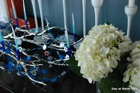 Hanukkah tablescape with menorah and candles