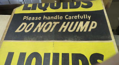 Old printed sign reading CHEMICALS Do Not Hump