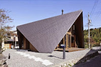 Origami House Design with A-Frame in an Old Village Surrounded by Mountains Origami House Design with A-Frame in an Old Village Surrounded by Mountains