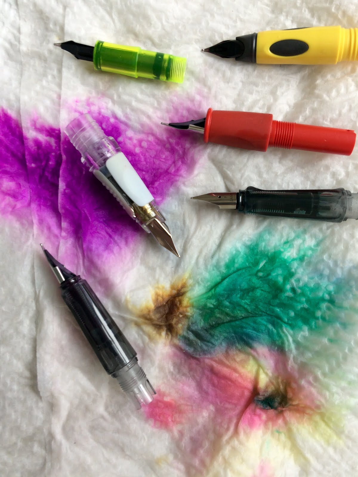 Fountain Pen Nibs Disgorge a Rainbow of Colored Ink.