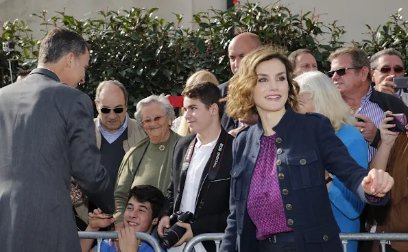 King Felipe and Queen Letizia visit Colombres, Asturias, Spain Queen Letizia wore Hugo Boss Trouser - pant, wore carolina herrera blouse, tous earrings, mango coat