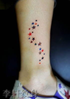 colorful stars tattoo on the leg