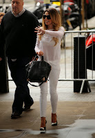 Cheryl Cole waves to fans