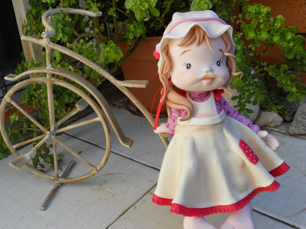 muñecas en bicicleta