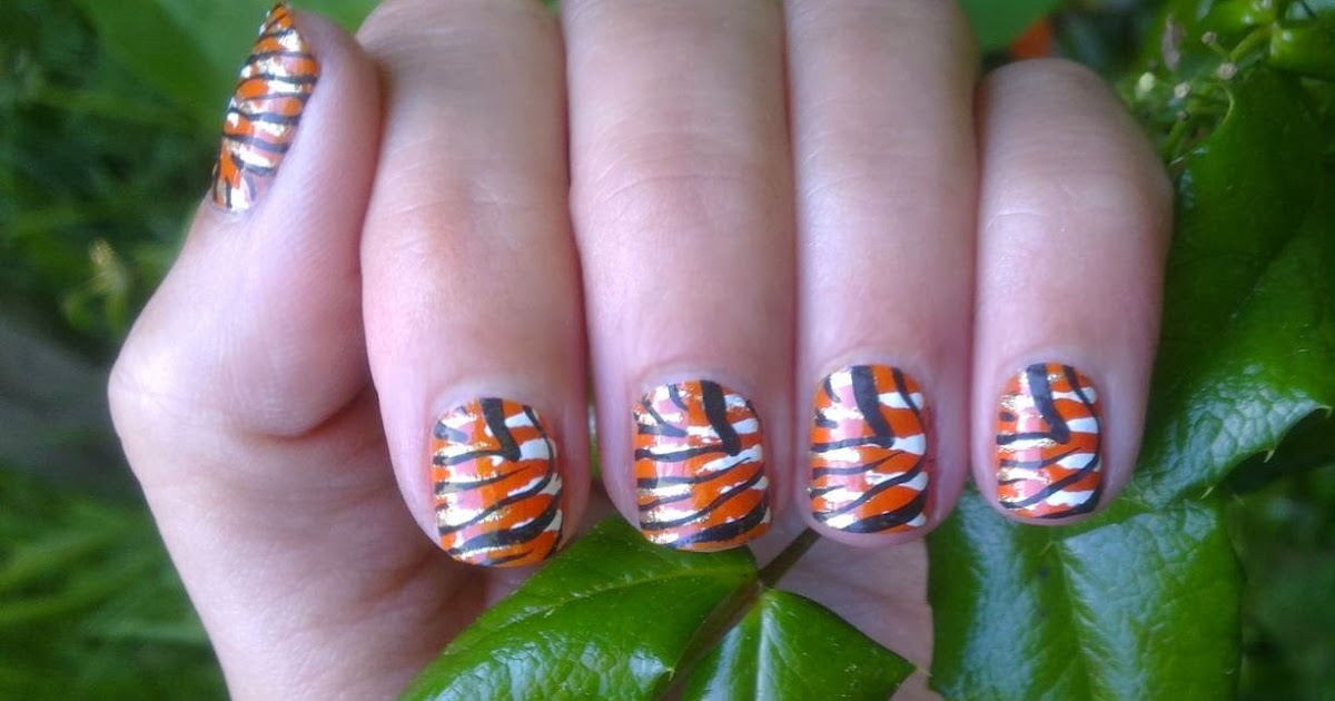 6. "Tiger Face Nail Art Step by Step" - wide 2