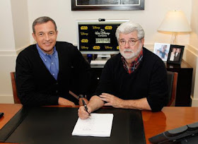 Bog Iger and George Lucas signing documents