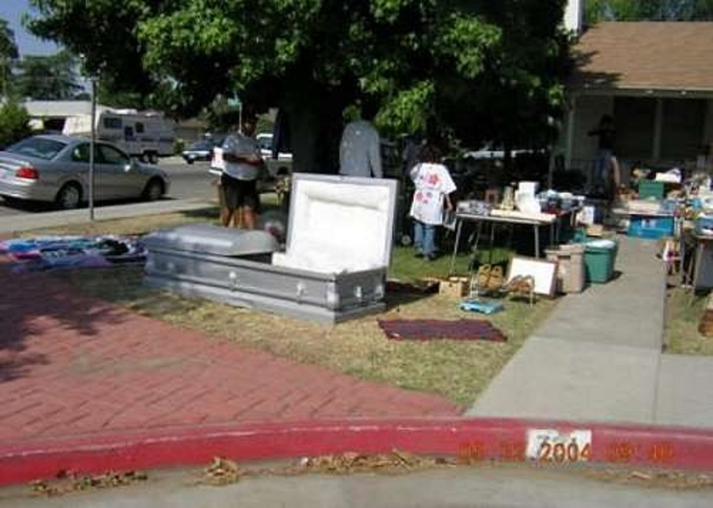 Wow! This yard sale has everything. Even Aunt Emma's casket ~