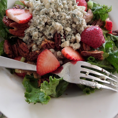 The Best Salad Ever:  A green salad topped with blue cheese, chicken, strawberries, and candied pecans.