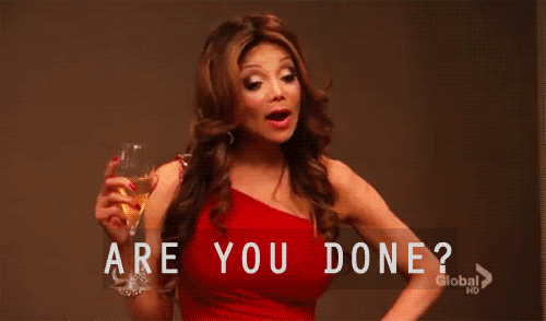 Animated gif of a woman with a champagne glass saying "are you done?"