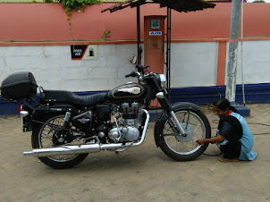 Checking and inflating the tyres at Kachur village petrol pump