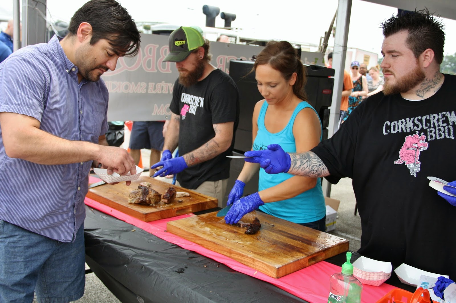Slicing meats at the Corkscrew BBQ booth.