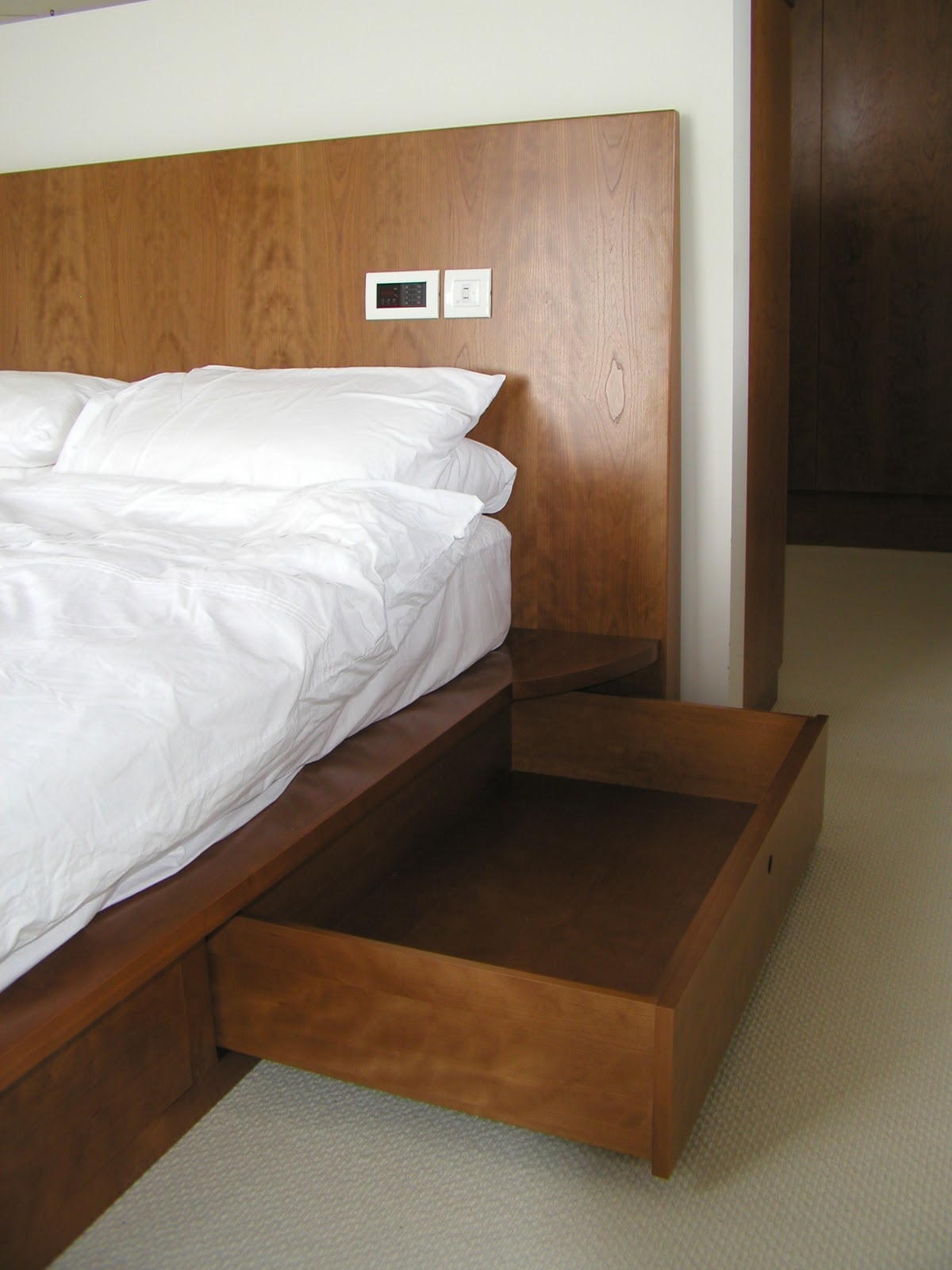 Baker and Baker Cherry wood adds warmth to bedroom en suite