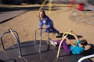On the playground, kids enjoying physical activity.
