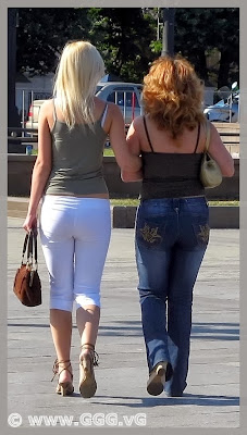 Girl in white breeches on the street