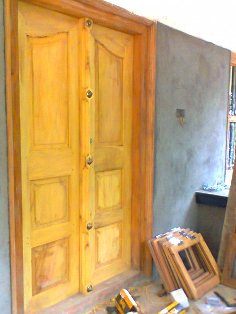 kerala style Carpenter works and designs: Main Entrance wooden double