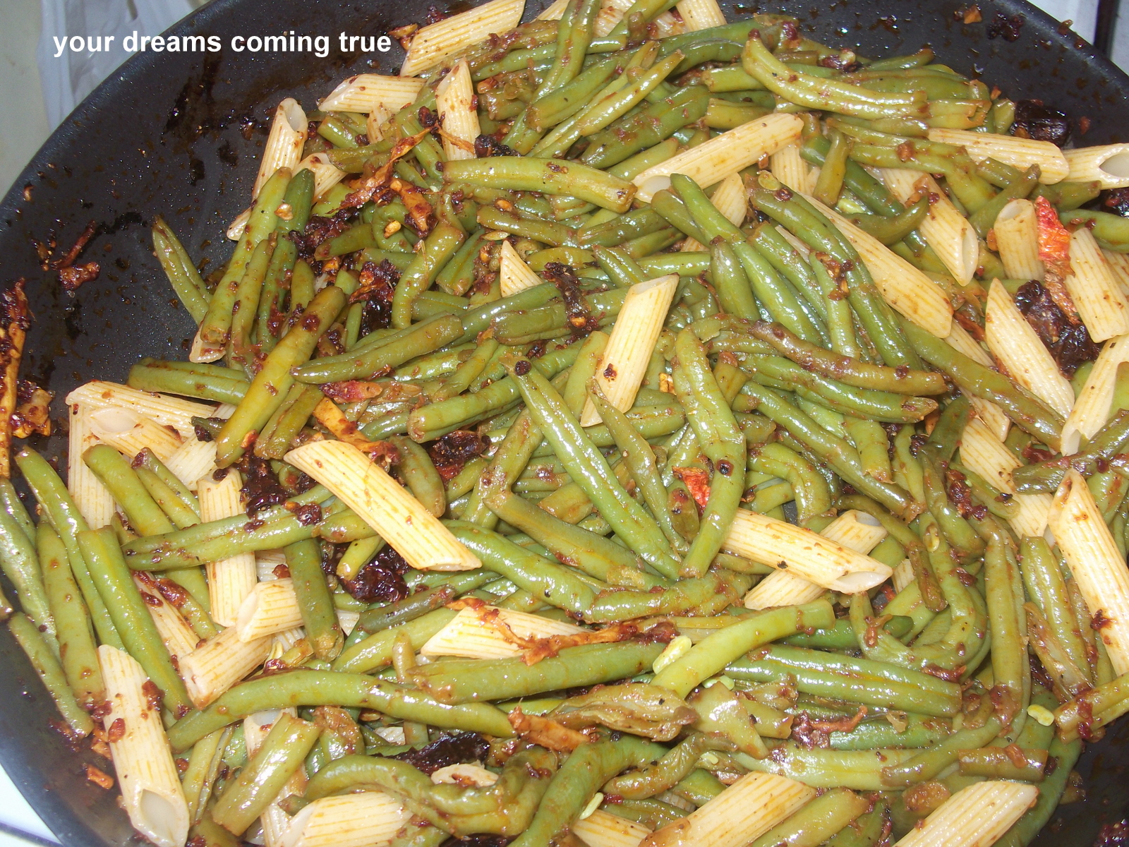 String Beans With Sun Dried Tomatoes, Garlic, Ginger And Penne Riggate.