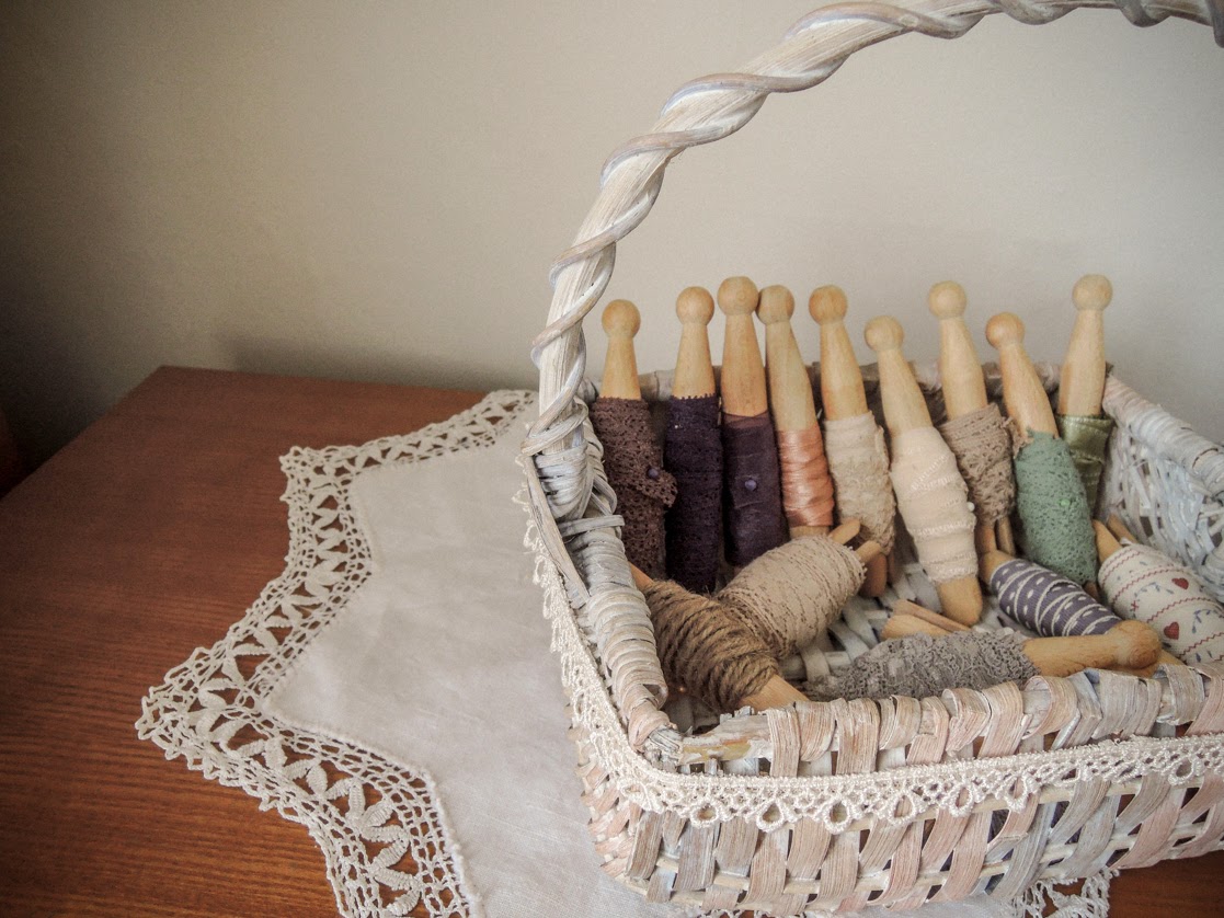 A handmade cottage Organised ribbons on wooden dolly pegs