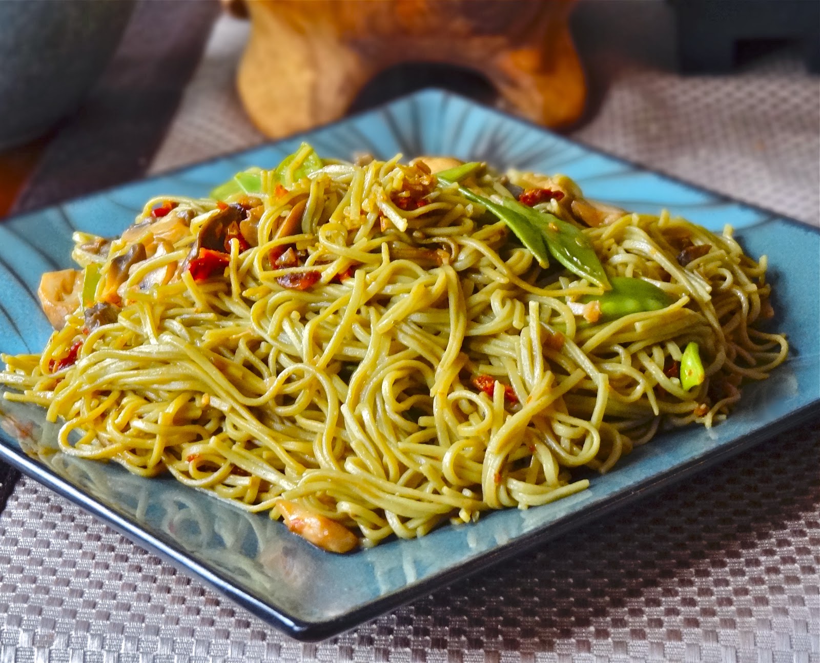 Green tea noodles in basil and sun dried tomato seasoned oil