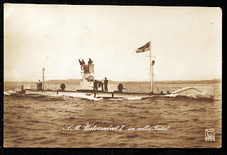Image of U-1 at sea with text 'S.M Unterseeboot I in foller Fahrt