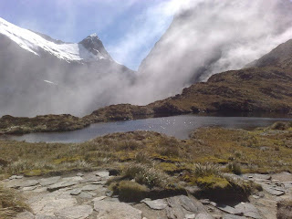 a lake surrounded by mountains