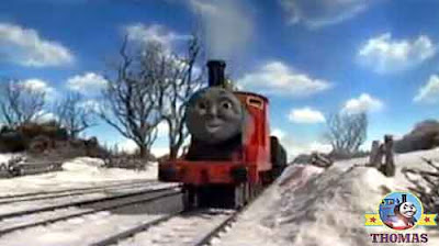 Kids big Xmas present train and James the engine pull away over the winter wonderland frost tracks