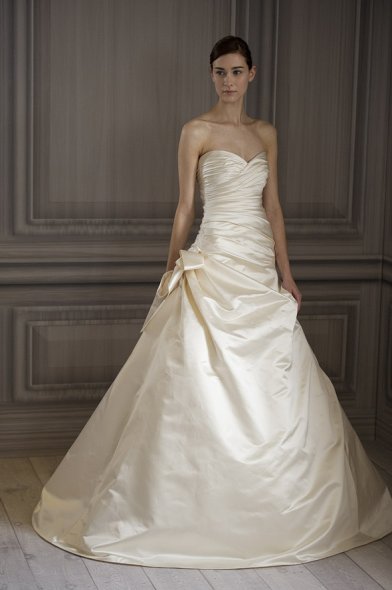 A strapless Ivory satin gown in a princess cut design