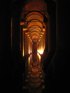 The columns and ceiling of the Basilica Cistern reflecting off the water.