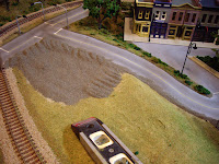 Adding sifted dirt for the road’s shoulders and parking lot