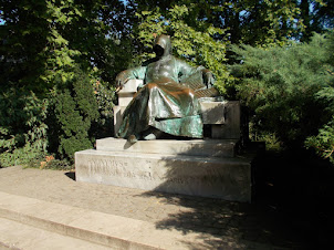 Grotesque statue of "ANONYMOUS " in Vajdahunyad  castle  complex.