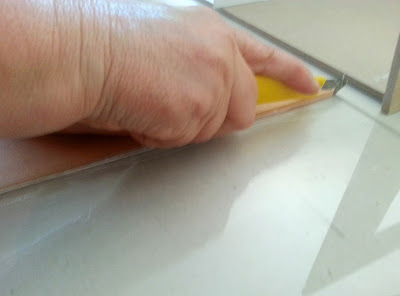 Cutting a piece of perspex with a p-cutter.