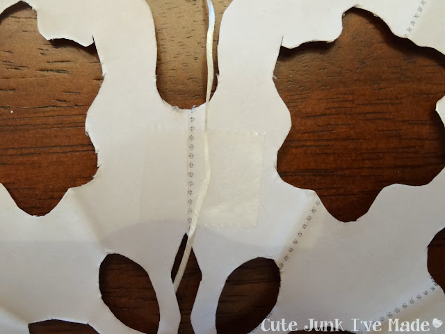 Paper Snowflake Curtain Tutorial - Snowflake on Dental Floss, taped