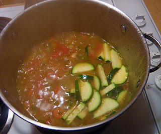 Zucchini added to soup pot