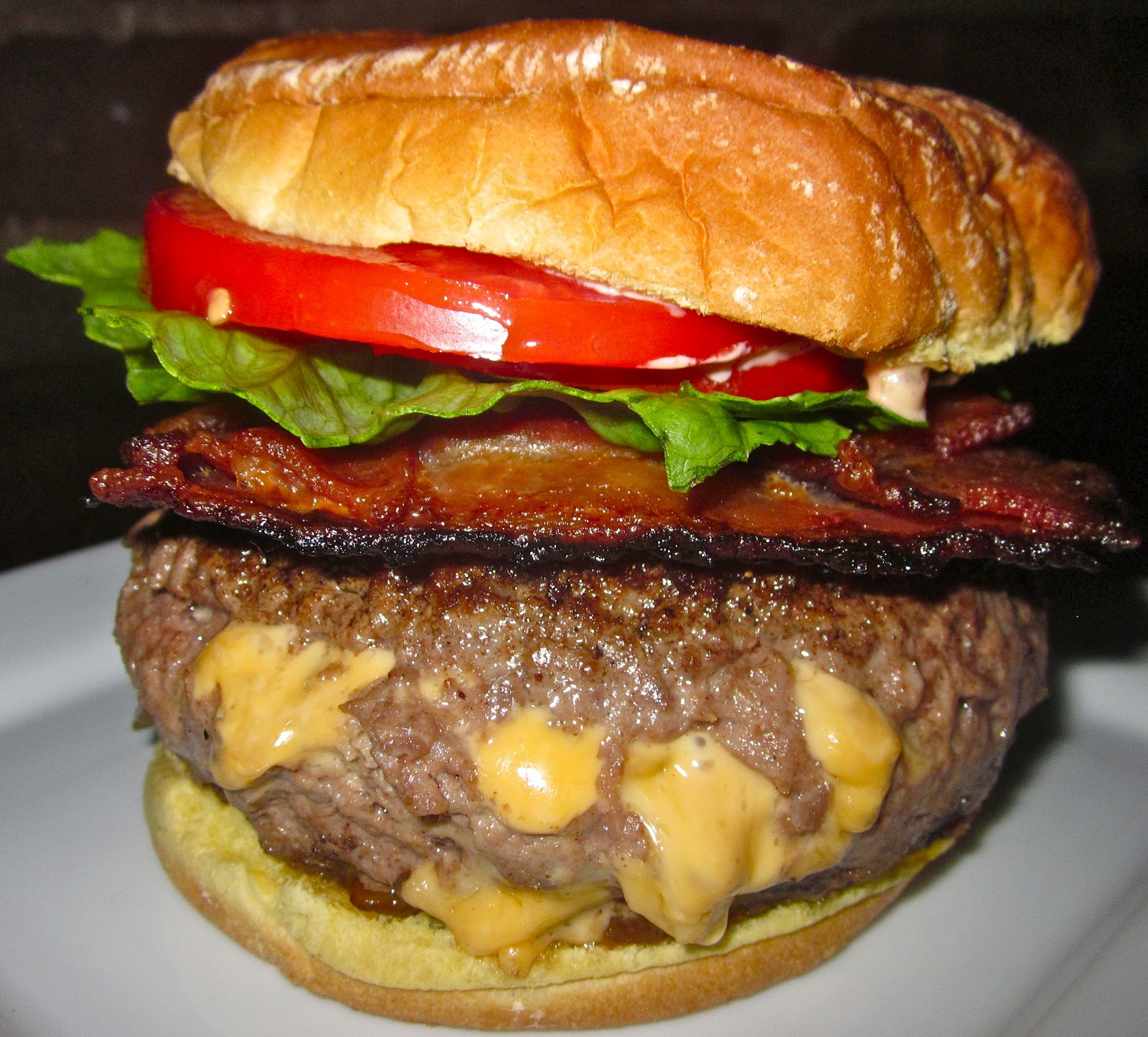 Haute + Heirloom Mac n' Cheese Stuffed Burgers with CocaCola Caramelized Onions & Weaved Bacon