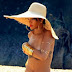 Singer Rihanna reveals tan lines as she poses topless for Vogue Brazil in beach photoshoot