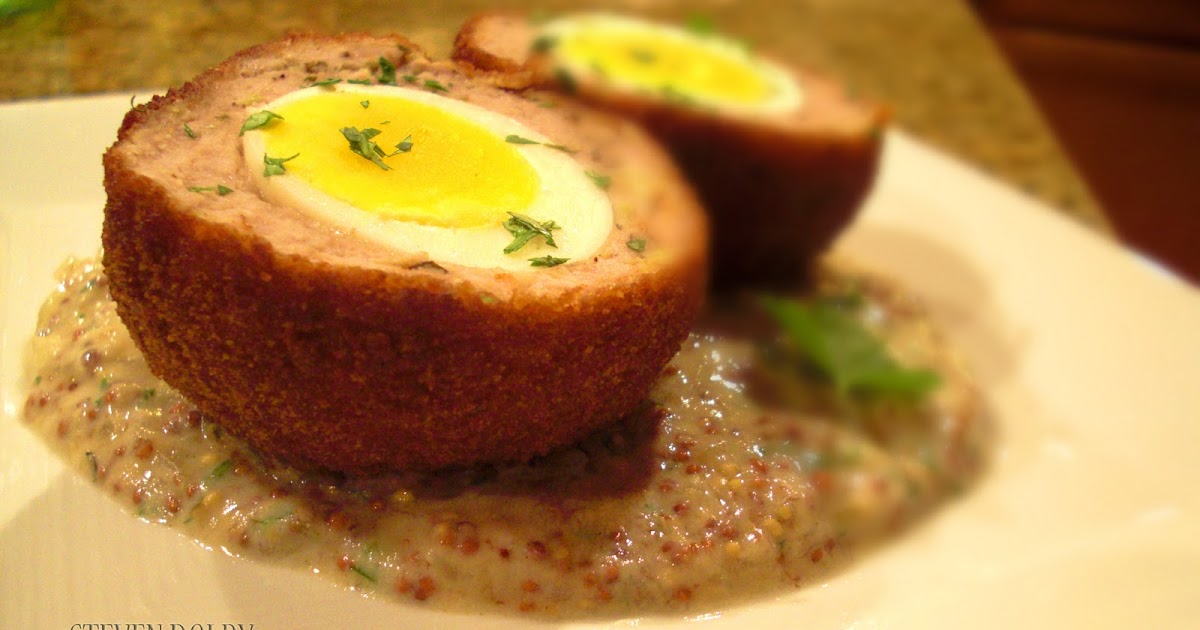 Scotch eggs with a creamy whole grain mustard sauce by Steven Dolby